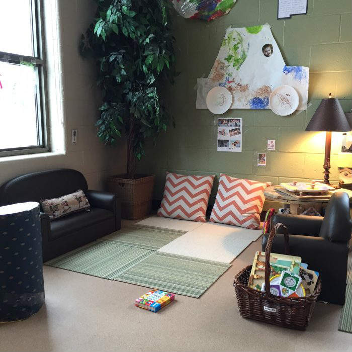 reading area with small couches and pillows